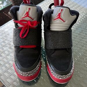 Jordan Black and Red High-Top Sneakers with Iconic Jumpman